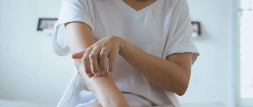 woman scratching her skin